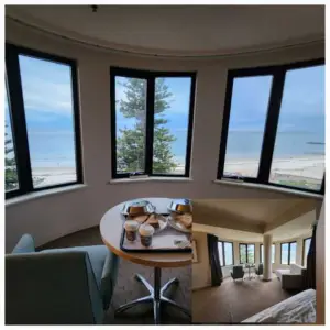 Ocean-view suite at Stamford Grand Adelaide overlooking Glenelg Beach, featuring panoramic windows and beachfront accommodation.