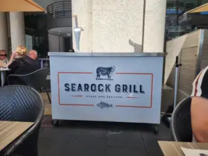 SeaRock Grill signage at Circular Quay, Sydney, highlighting the restaurant's waterfront location and reputation for premium steaks and fresh seafood.
