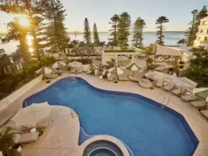 Pool and leisure area at The Brighton Hotel Sydney – MGallery Collection overlooking Botany Bay at Brighton-Le-Sands.
